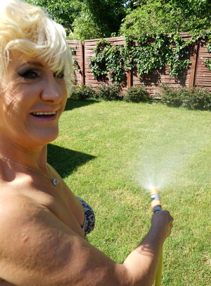 Mature.nl Horny blonde mature woman getting naughty in her garden mature xxx sex photo
